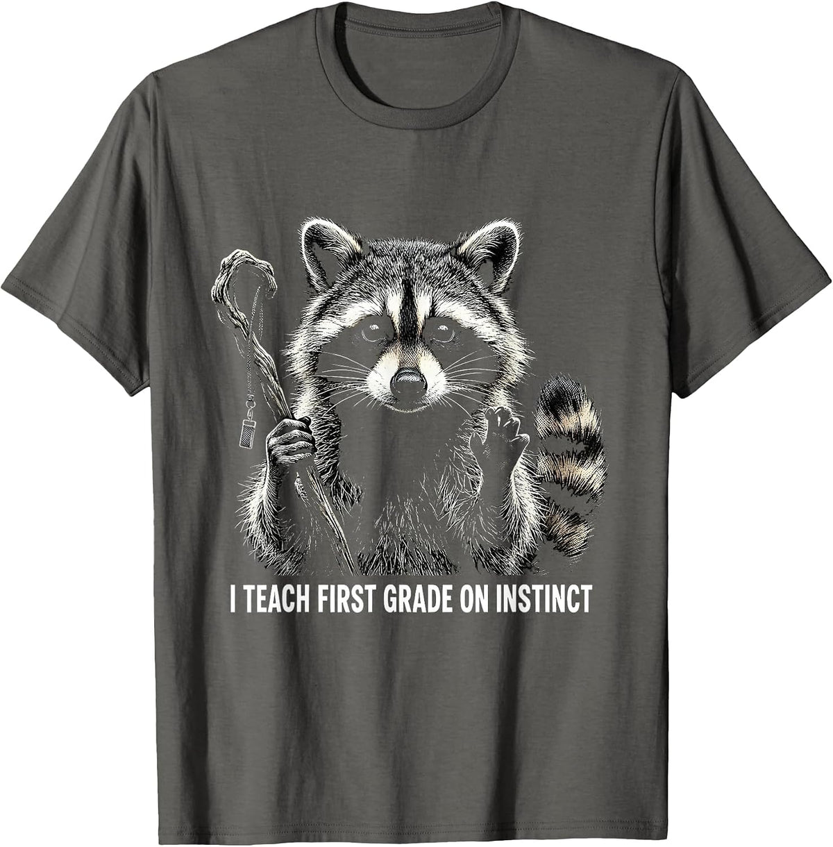 I Teach First Grade On Instinct Funny Raccoon Teacher Humor T-Shirt - Asphalt Grey