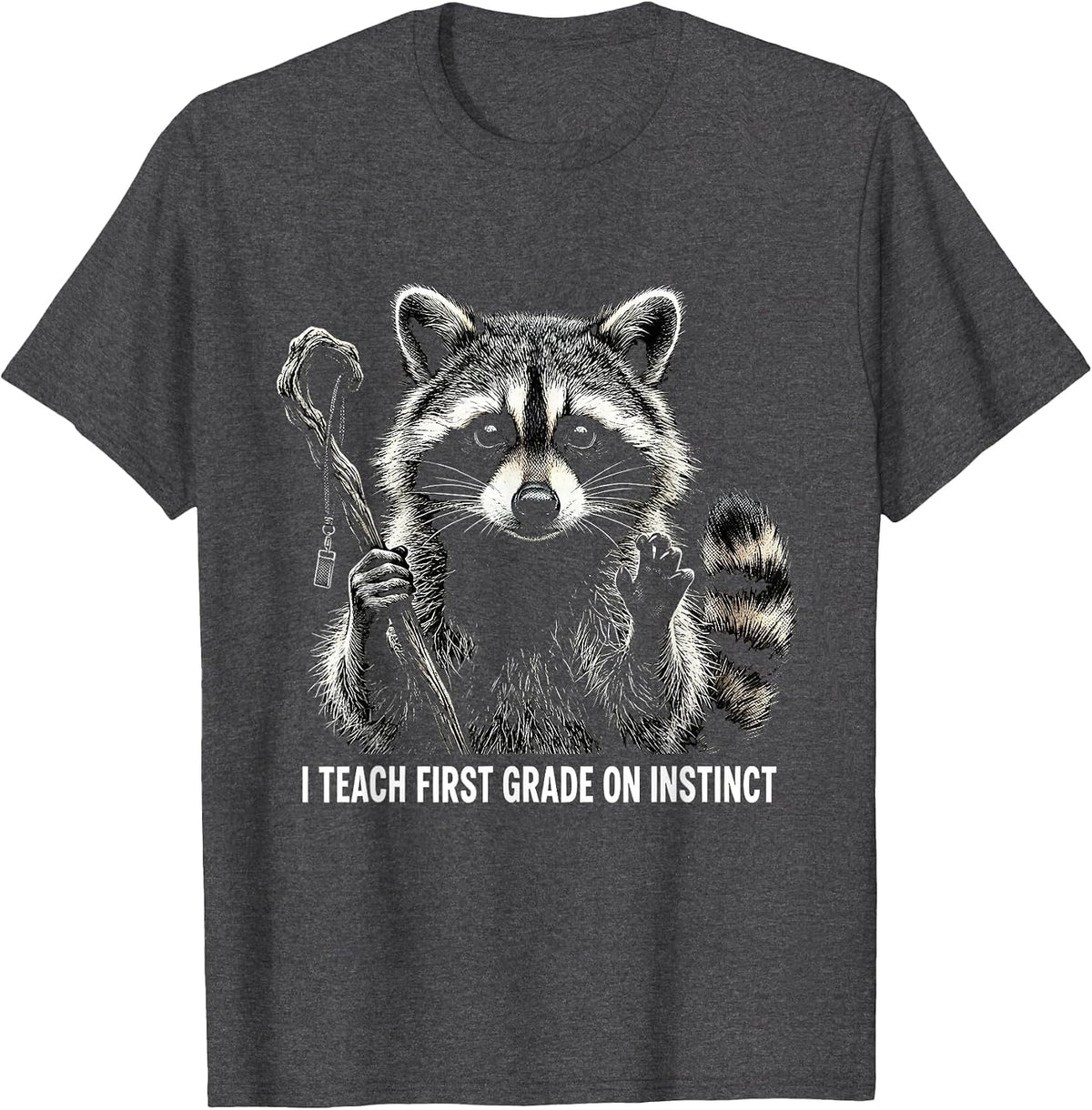 I Teach First Grade On Instinct Funny Raccoon Teacher Humor T-Shirt - Dark Heather Grey